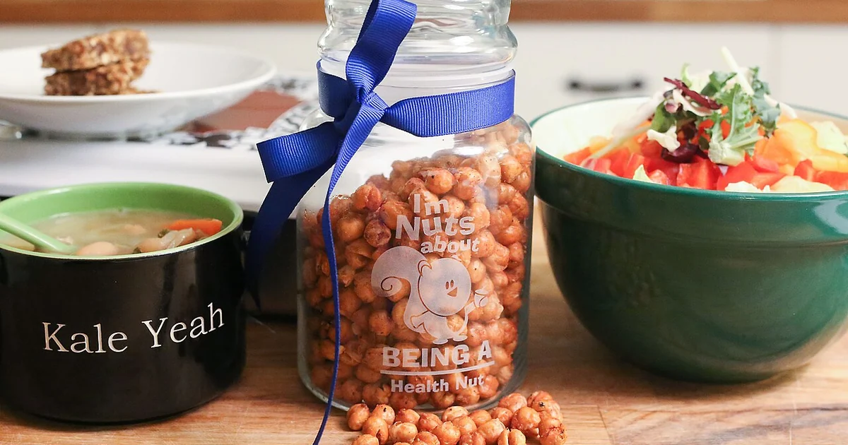 File:Chick peas garbanzo beans in a personalized glass mason jar next to a bowl of Tuscan kale and white bean soup and spaghetti squash with Mediterranean vegetable pesto sauce on a wood table (16085956870).jpg