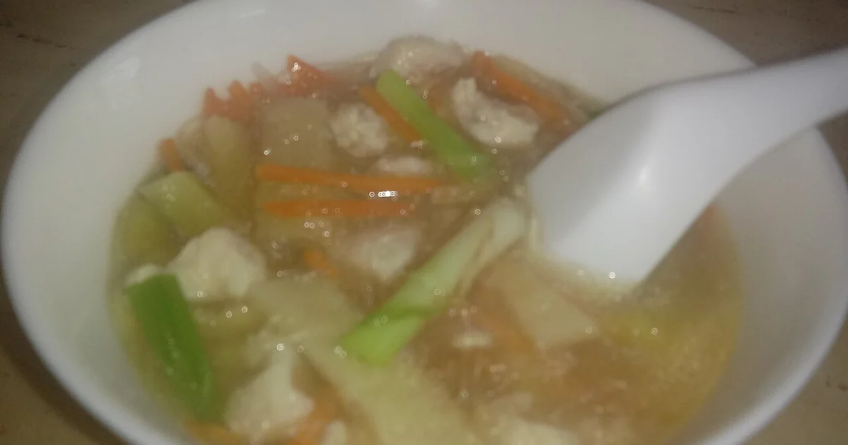A bowl of Pickled Mustard Green Chicken Soup (酸菜雞絲湯) of Sichuan Cuisine.